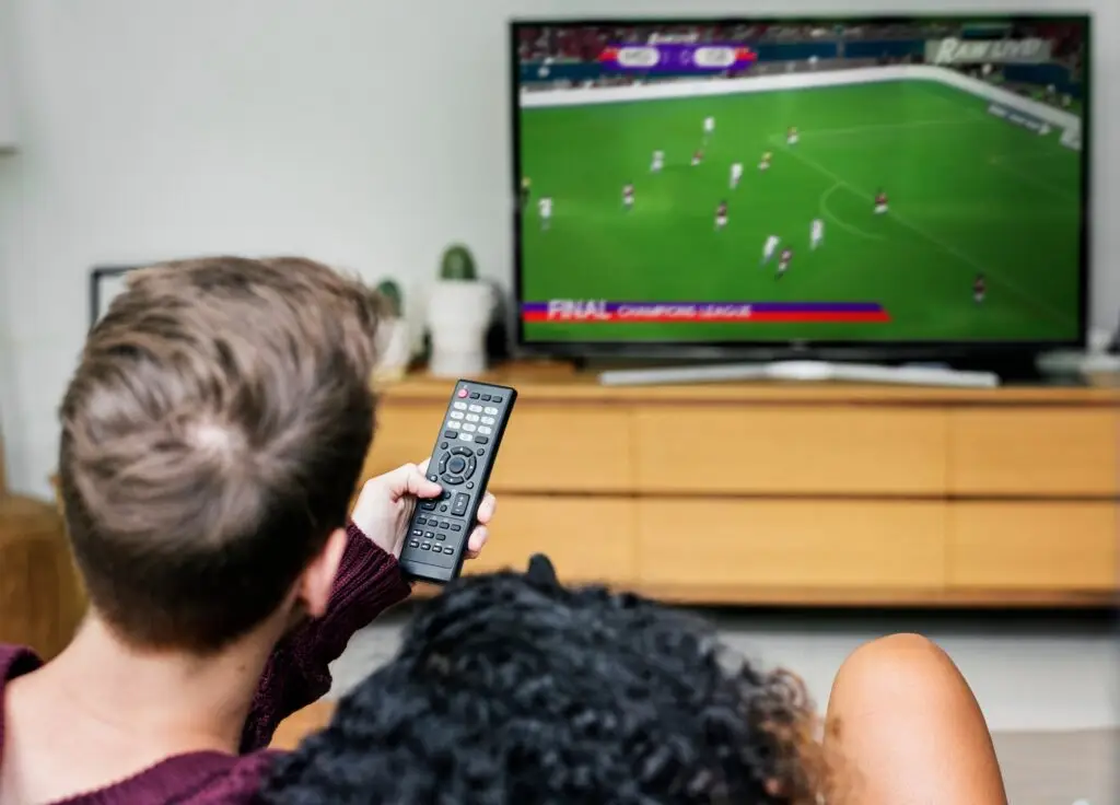 Couple watching a football game on TV